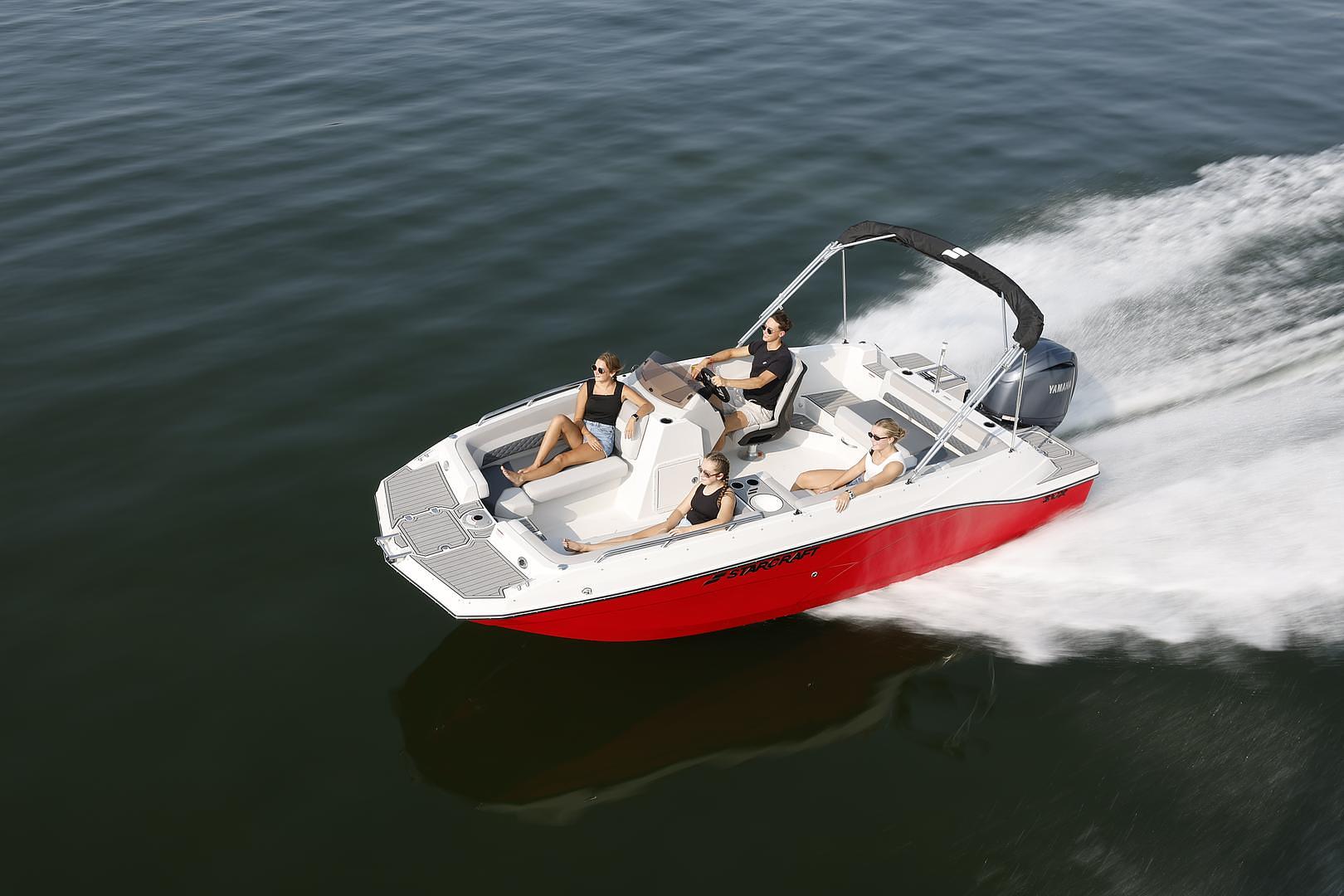 Starcraft deck boat with guests on the water