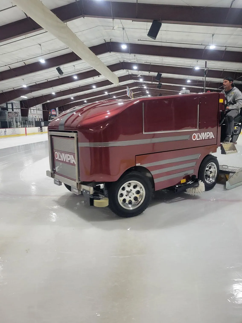 CTM Services mobile repair technician working on Olympia ice resurfacer on-site