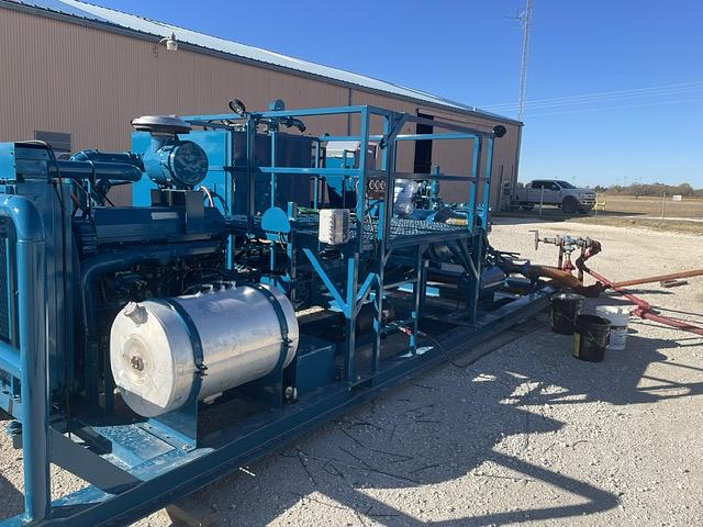 Pumping skid built with a tank and hose connections