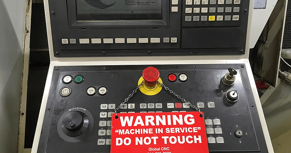 Machine in service tag on a CNC control panel