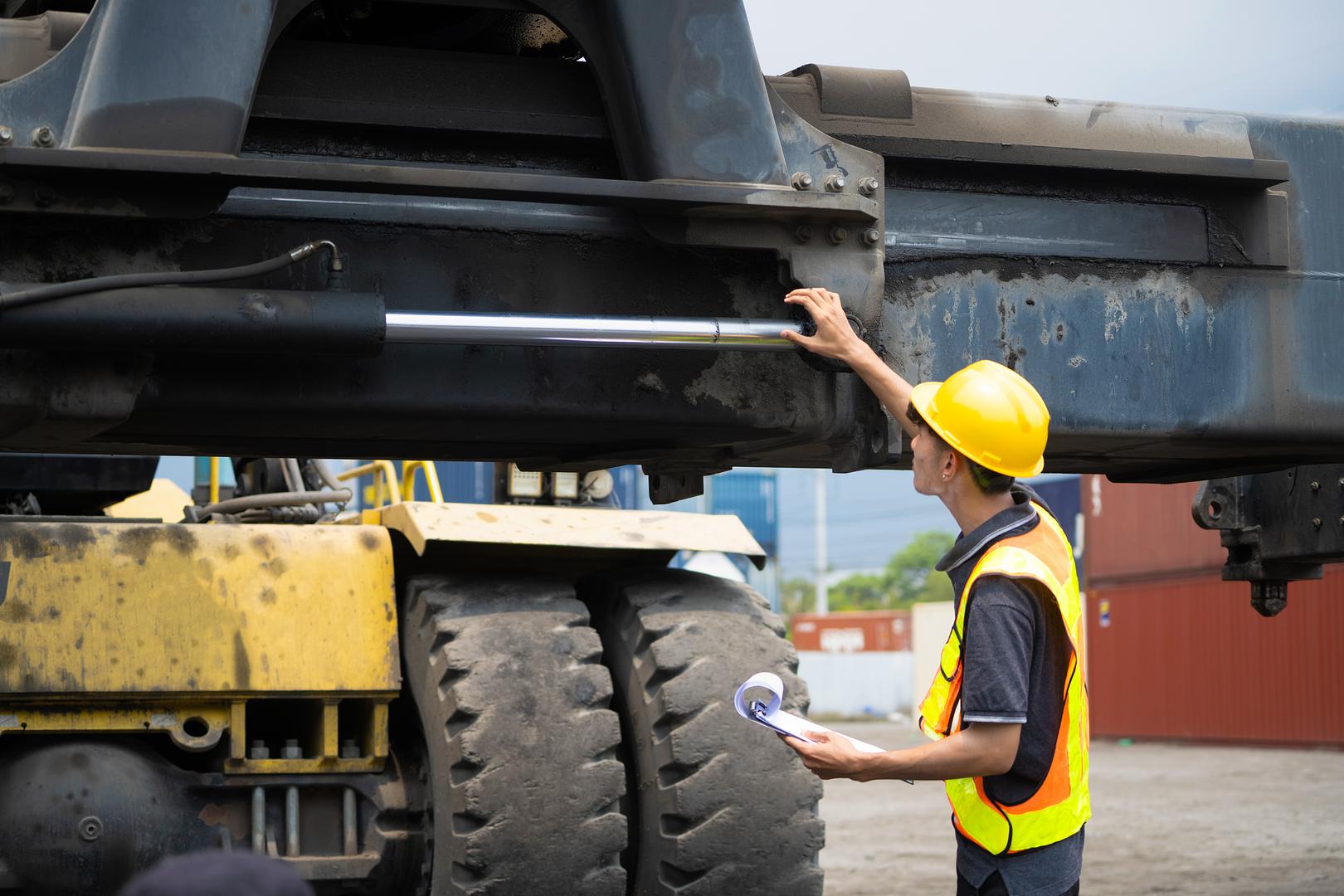 Technician diagnosing equipment on site
