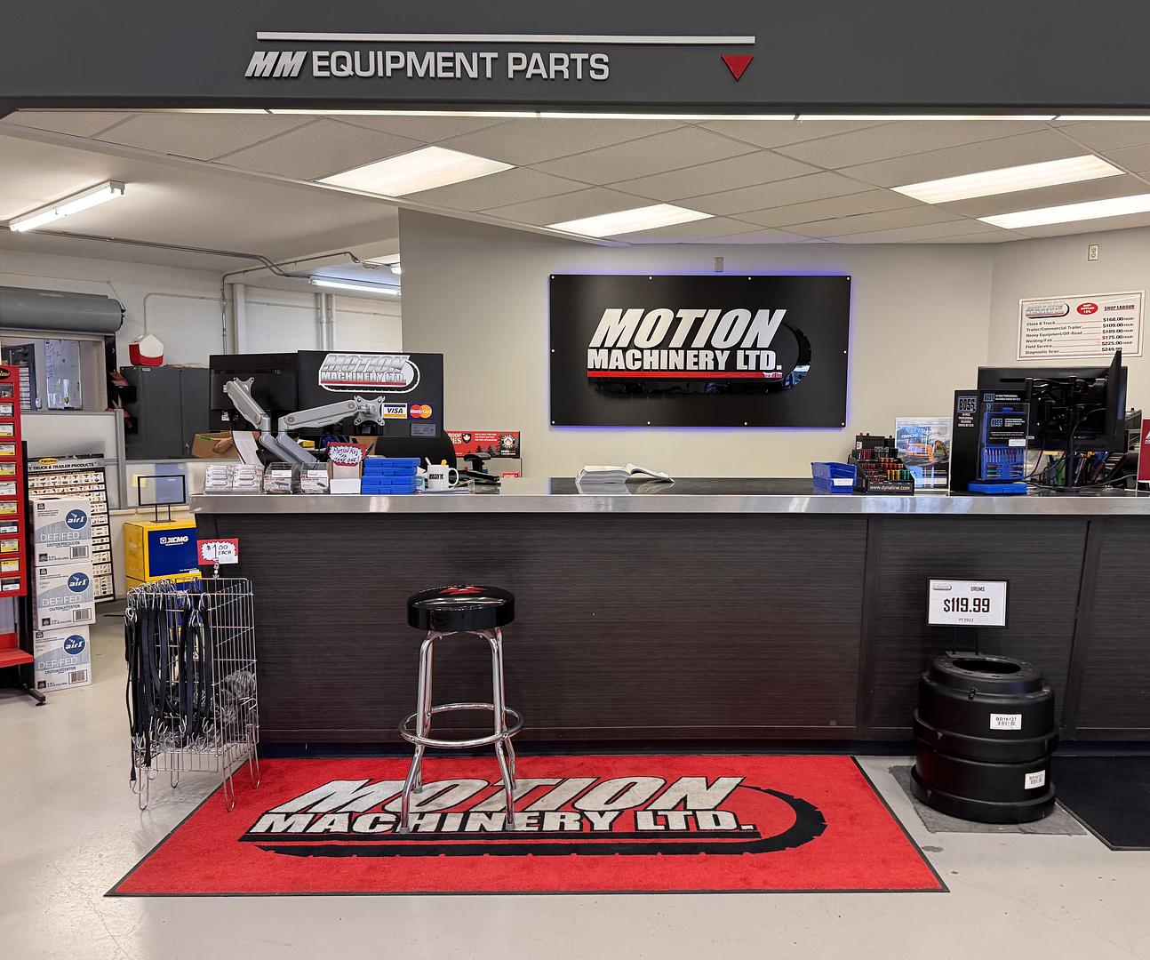 Motion Machinery parts advisor looking up a part at the front counter