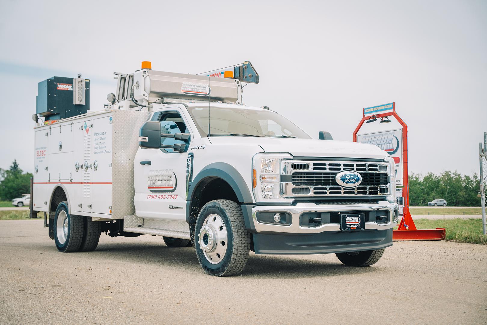 Motion Machinery field service truck loaded with a crane and service body in Stony Plain