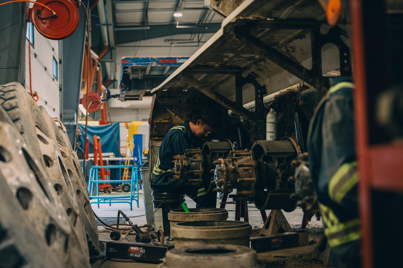 Wheel ends and brake drums removed from a trailer for inspection in the Motion Machinery shop