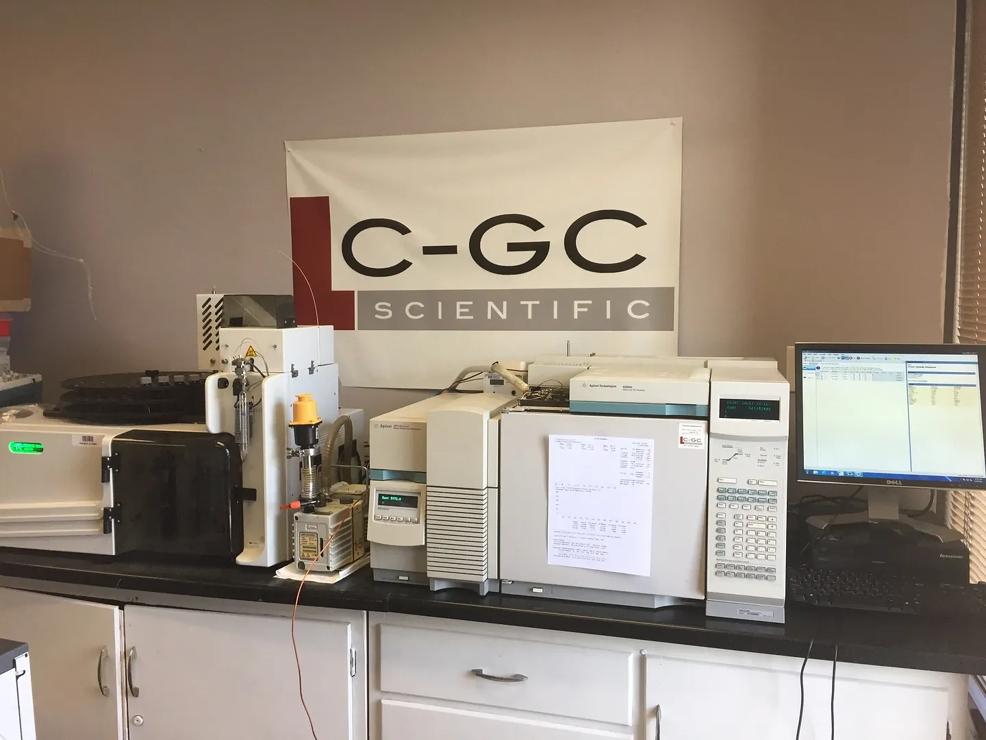 Agilent GC system on the bench in front of the LC-GC Scientific banner