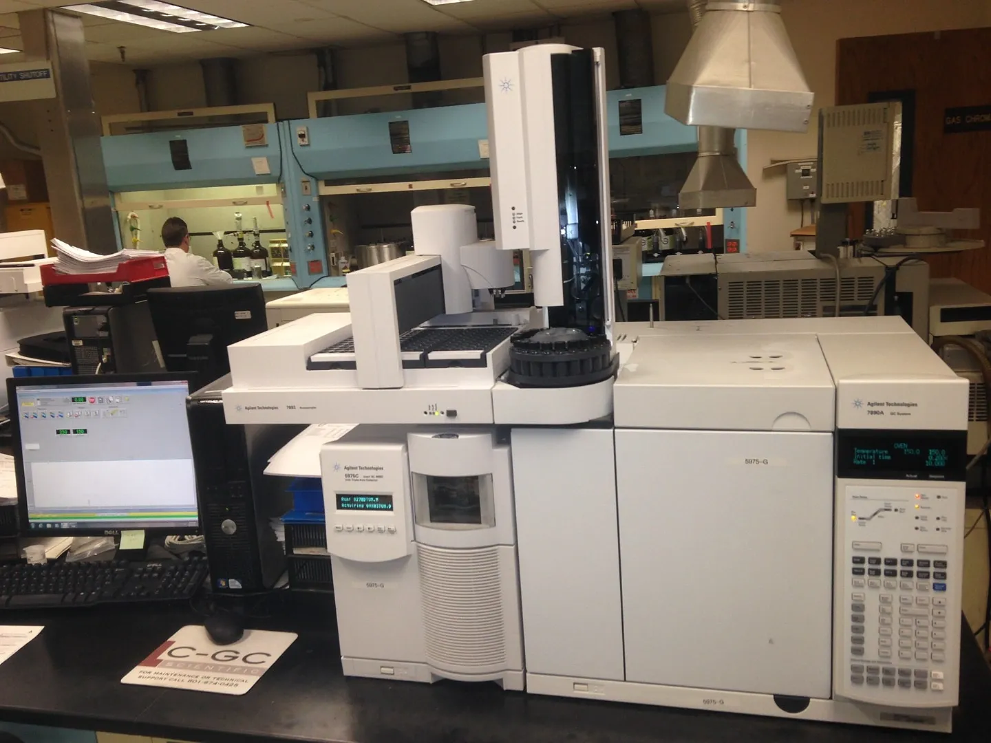 LC-GC Scientific technician working on an Agilent GC-MS system in the shop