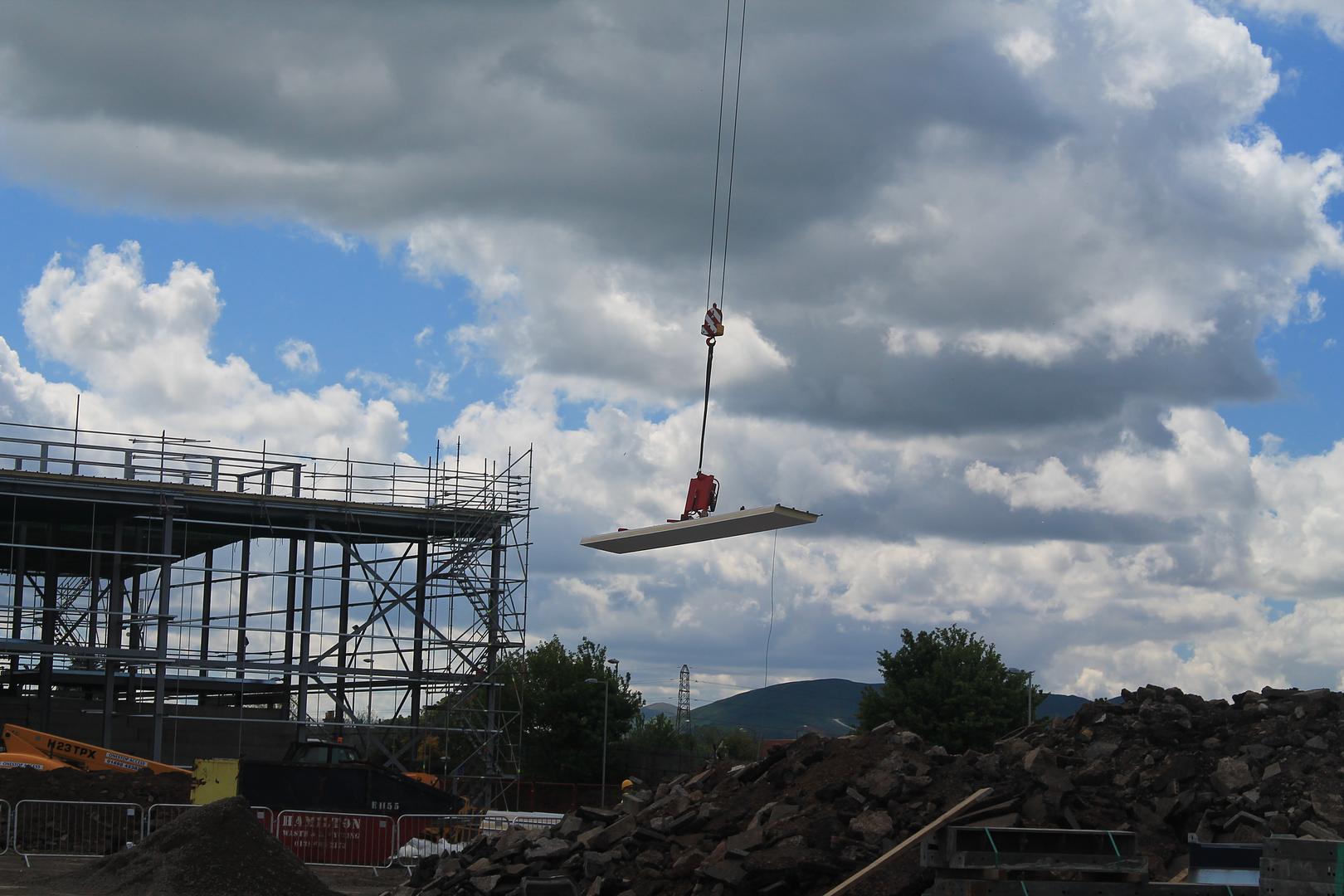 Installing Roofing Panels Safely with Cladding Lifters on Steel Frame Structures