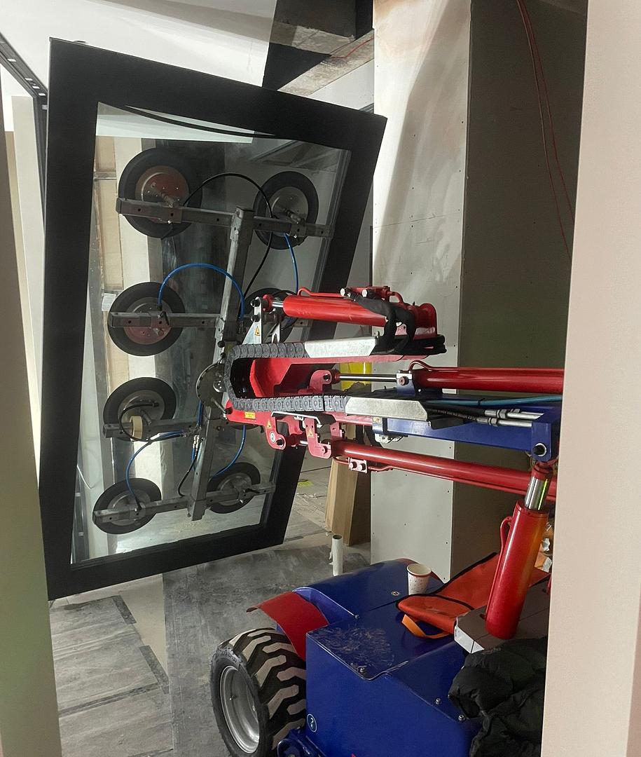 Glazing in Tight Spaces: Why Canopy and Confined-Site Jobs Need a Glazing Robot, Not a Crane