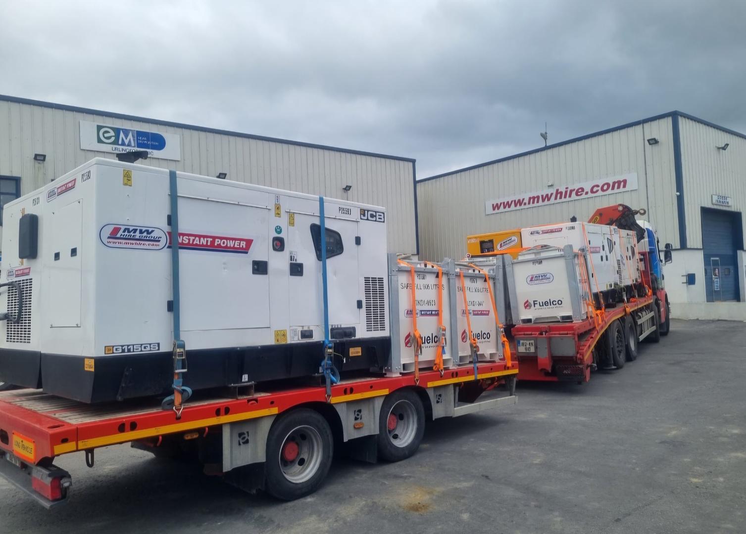 Load of Generators and external fuel tanks on the way to a rental project