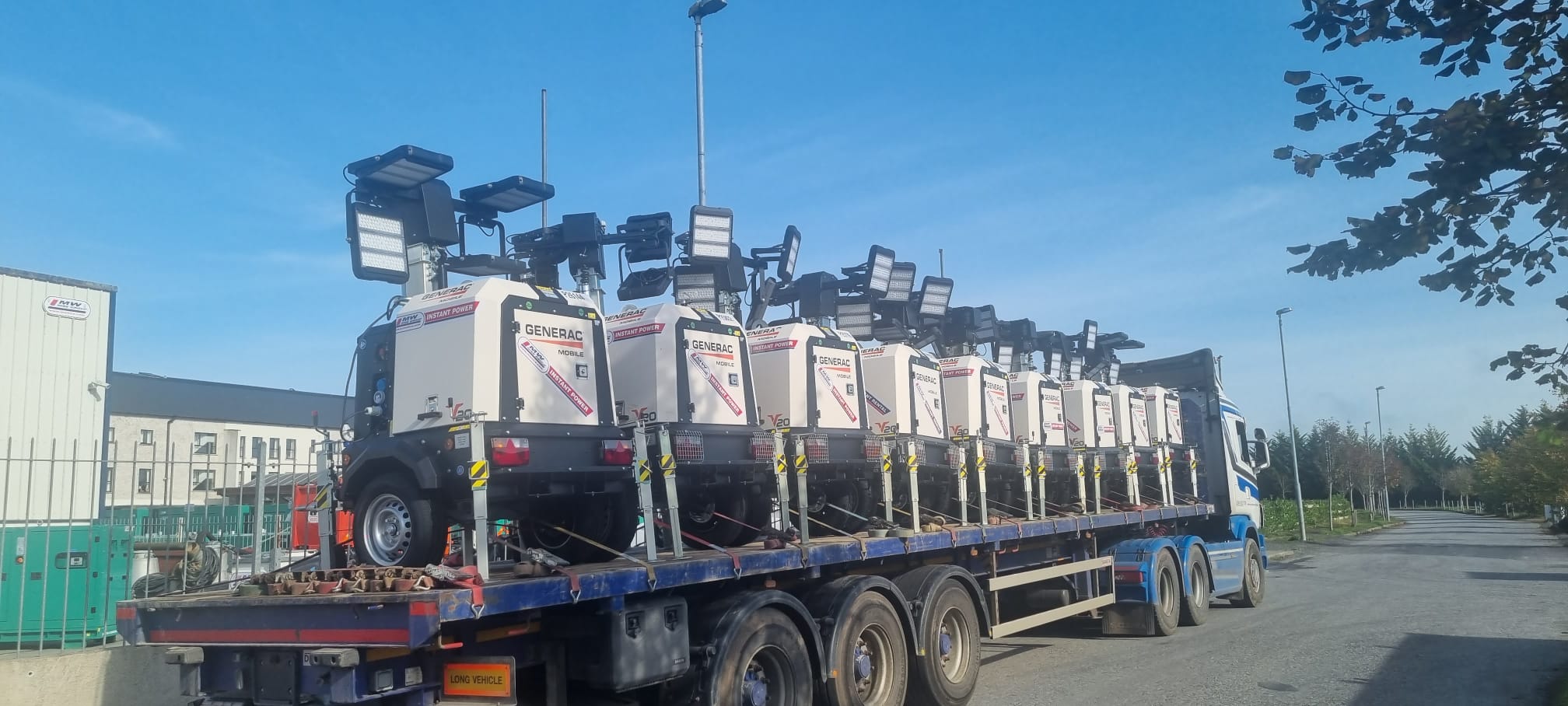 Load of lighting towers heading away 