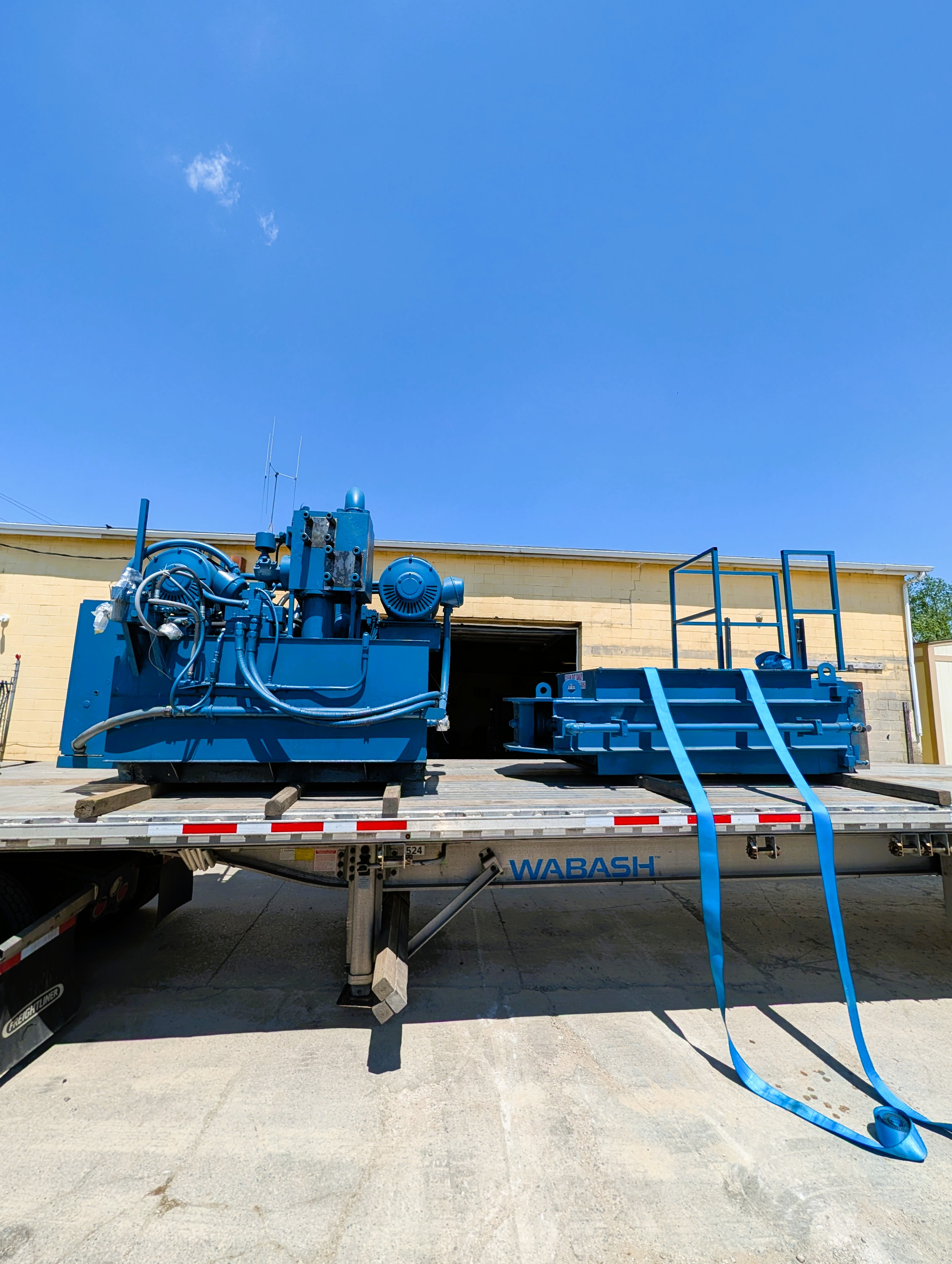 BRT Reconditioned Two-Ram Baler Loaded Out and Headed South for Installation
