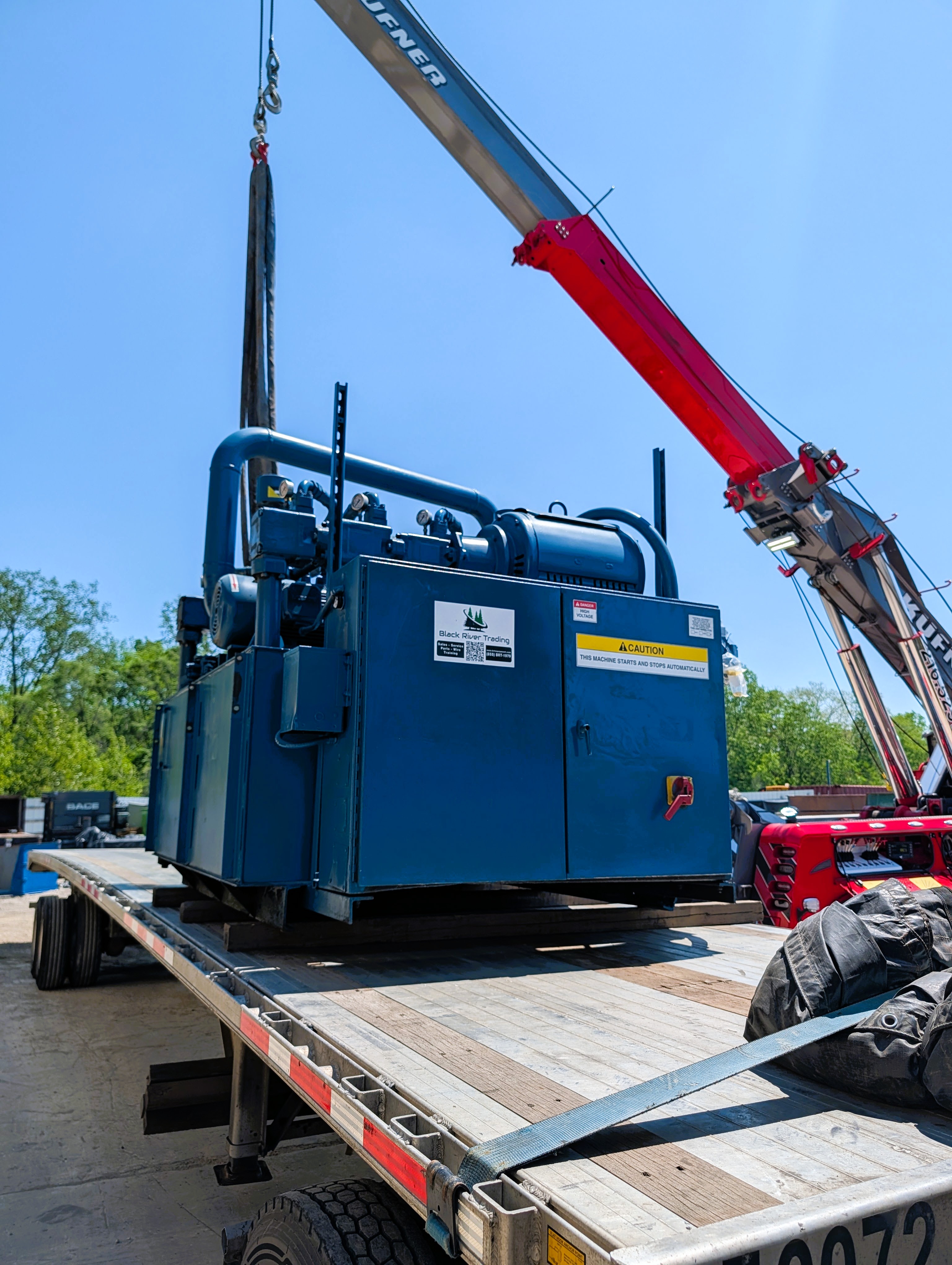 BRT Reconditioned Two-Ram Baler Loaded Out and Headed South for Installation