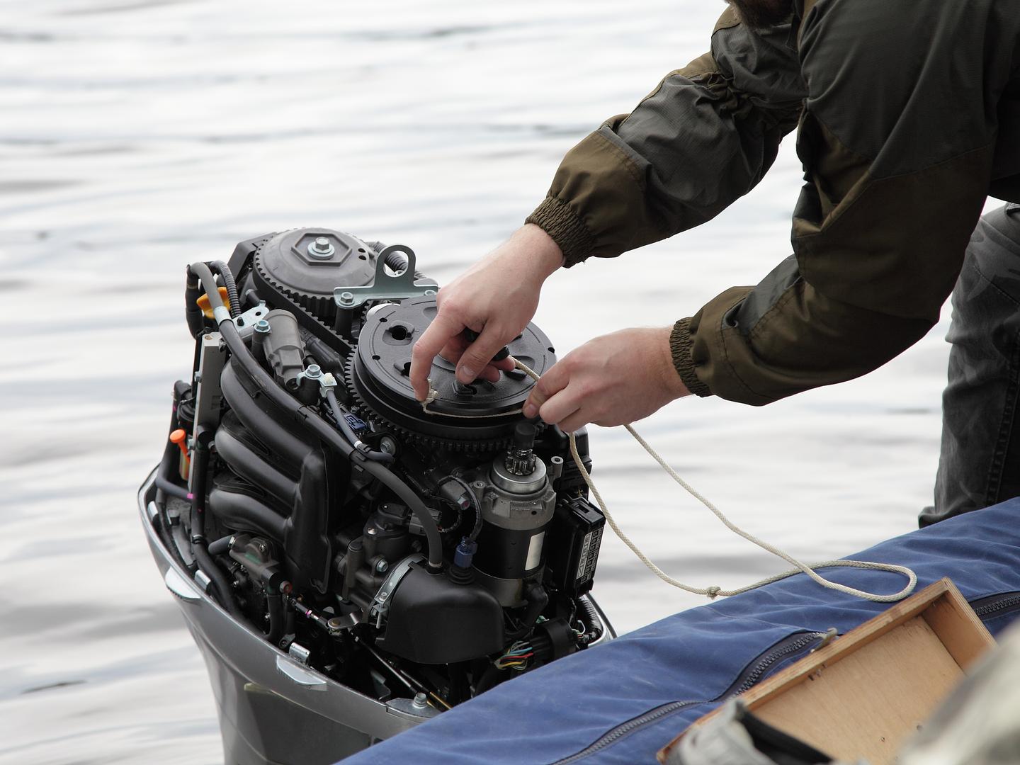 Marine technician performing engine maintenance at Mattas Marine and RV