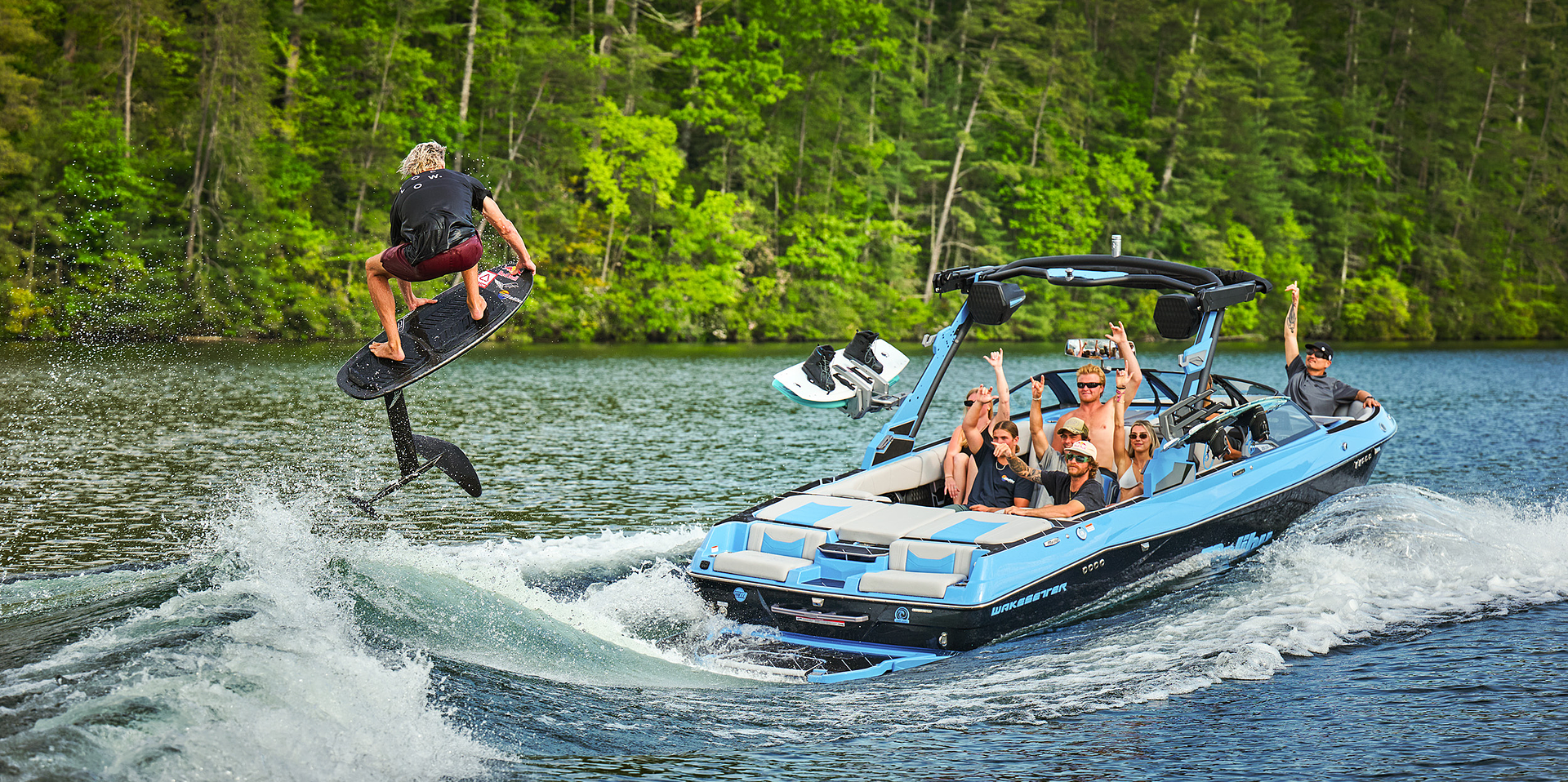 Malibu Wakesetter 23 LSV towing a wakesurfer catching air on a hydrofoil board