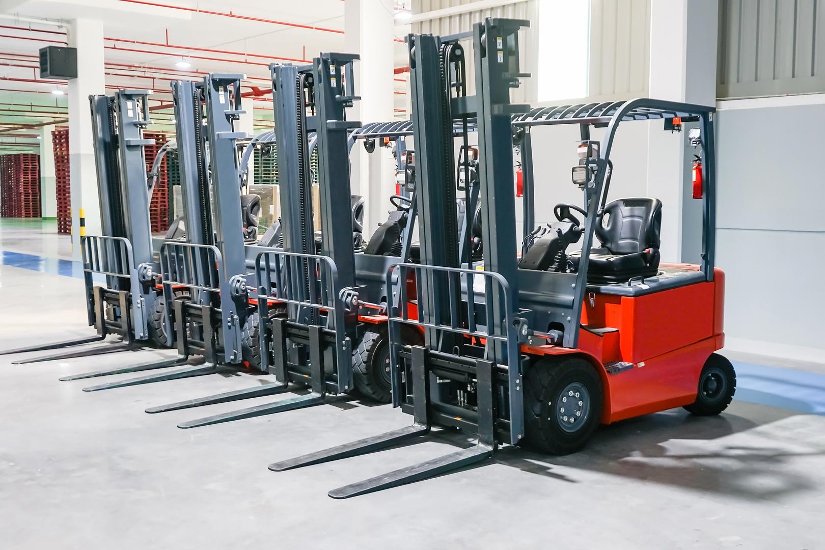 Forklift technician working on equipment