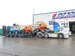 Load Of Ex Rental Booms…SOLD…On Their Way