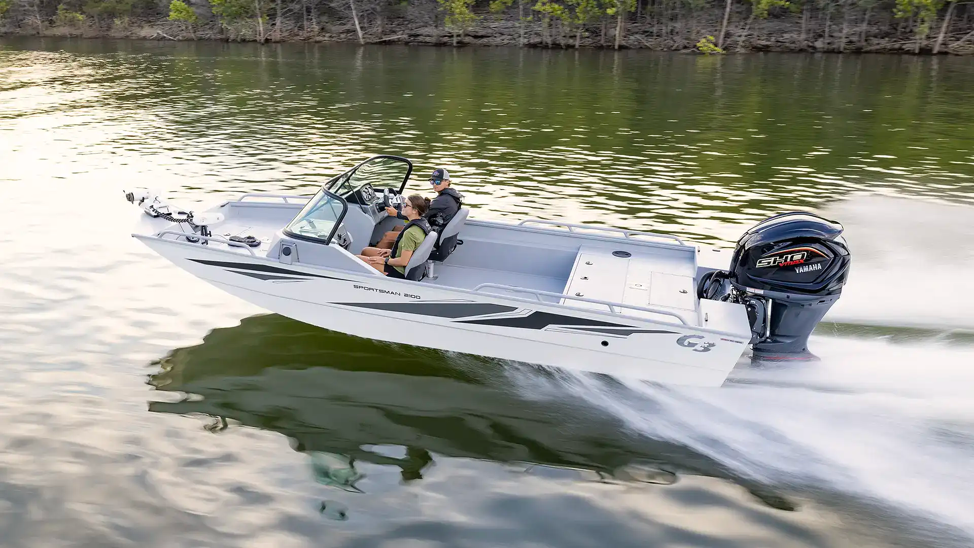 A Yamaha boat idling on calm water at the start of the season