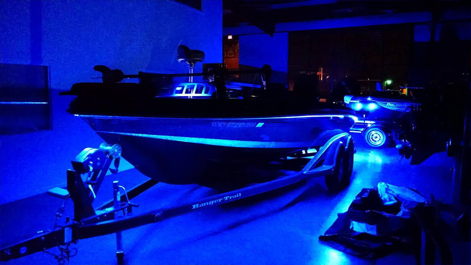 Marine LED underglow lighting installed on a boat at night
