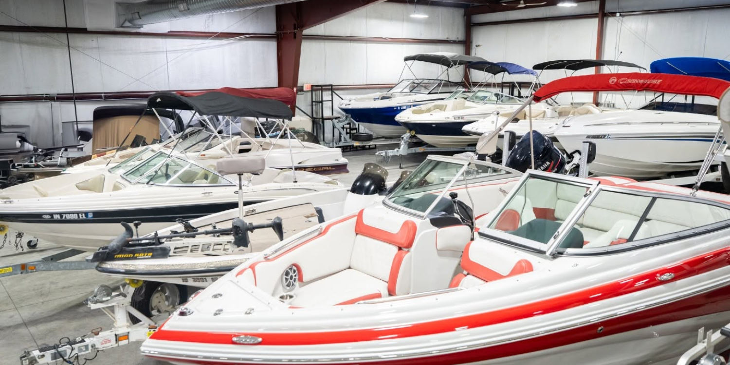 Pre-owned pontoons and fishing boats on the lot at Reeder-Trausch Marine Indy
