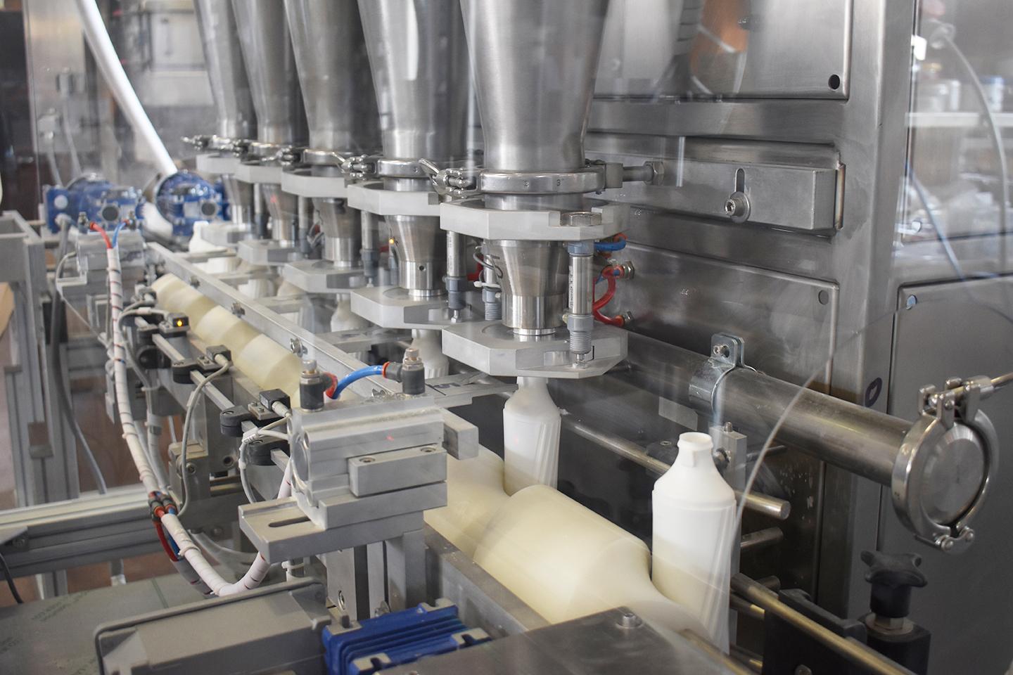 Mixing, filling and capping line for powders